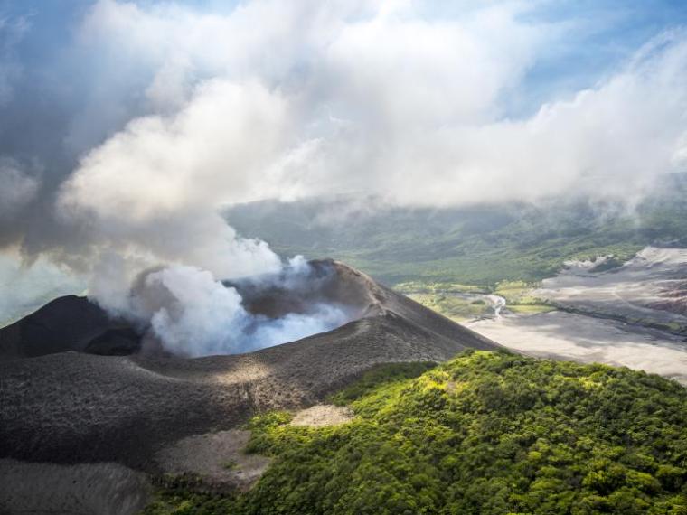 a steam train is coming down the mountain