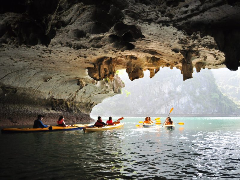 a group of people riding skis on a body of water