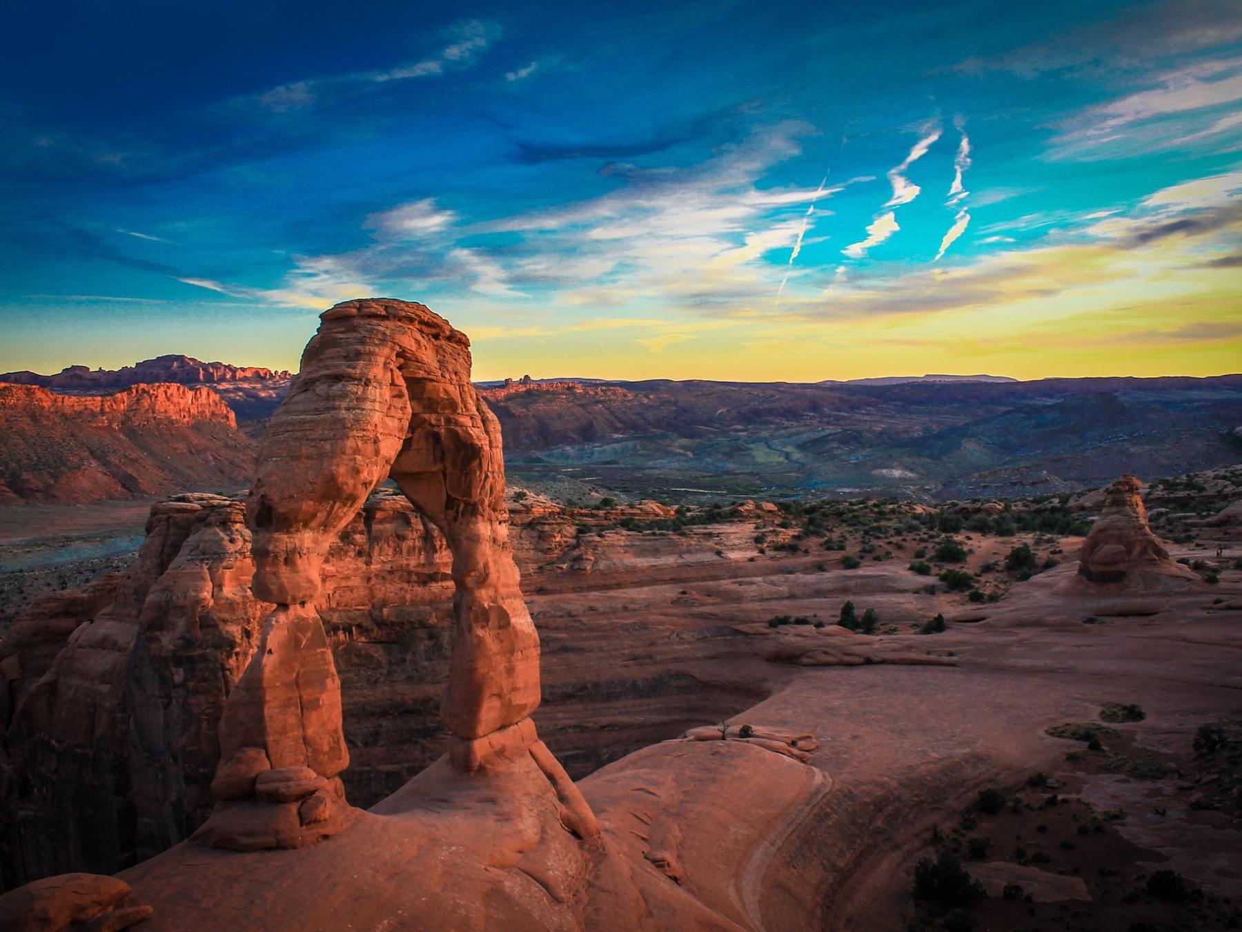 a canyon with a sunset in the background