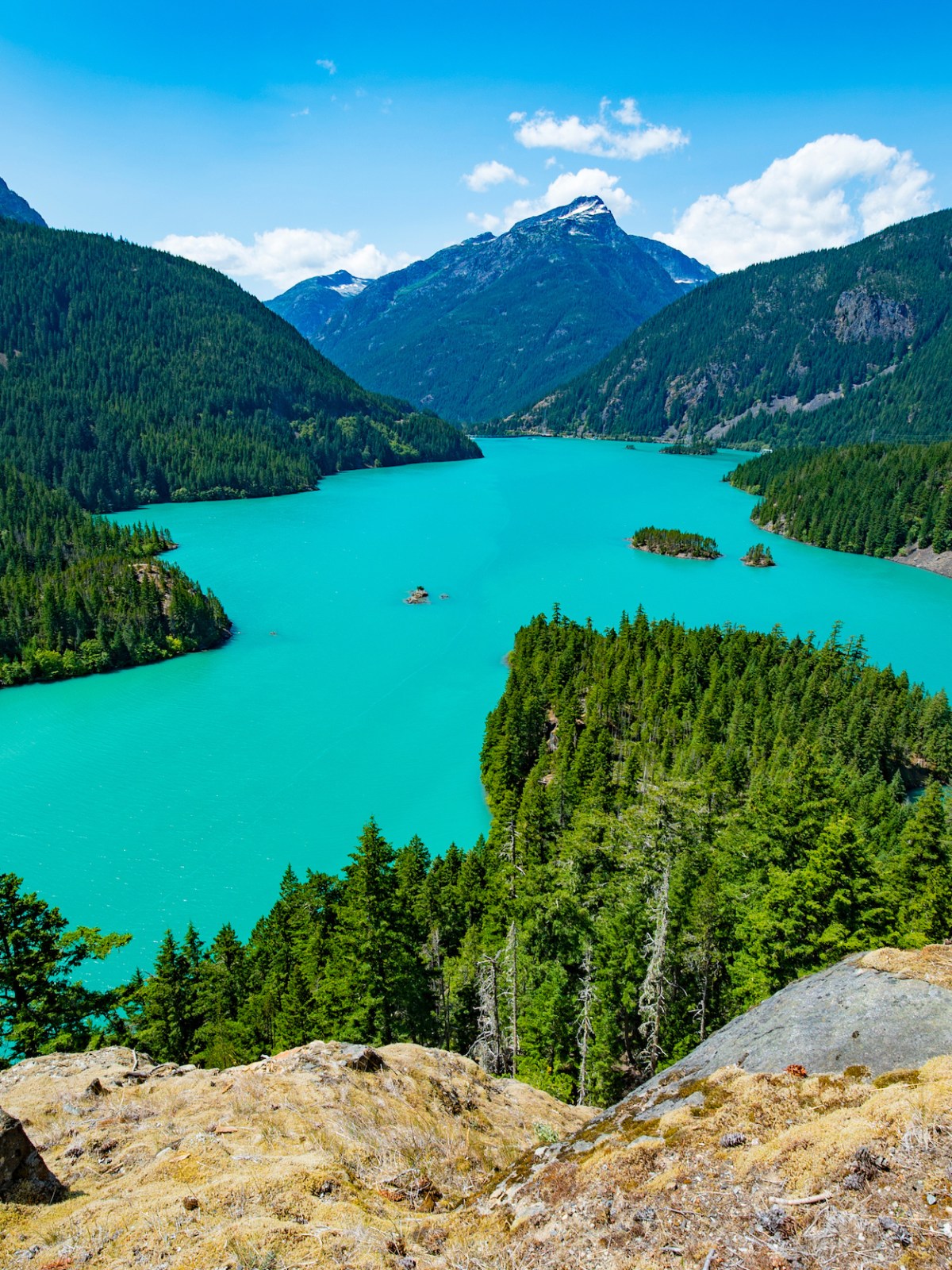 a body of water with a mountain in the background