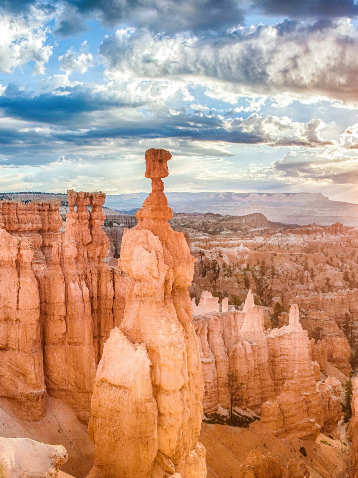 a canyon with Bryce Canyon National Park in the background