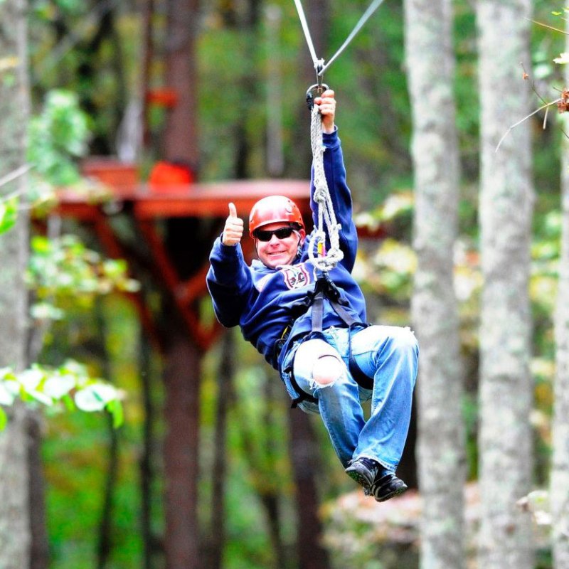 a person doing a trick in the forest