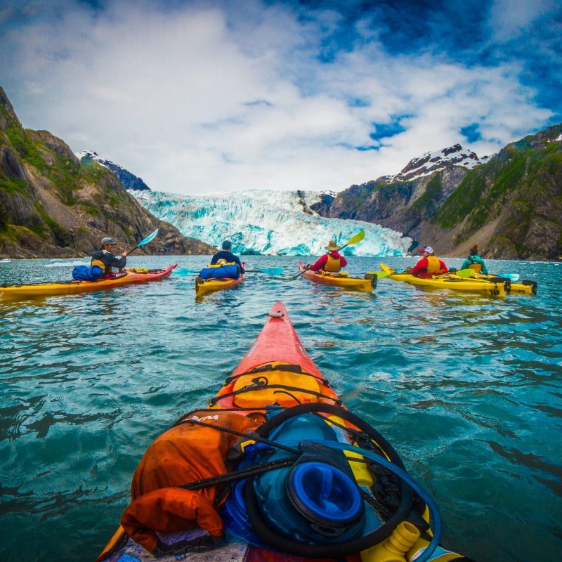 a body of water with a mountain in the background